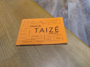 Taize song book on pew